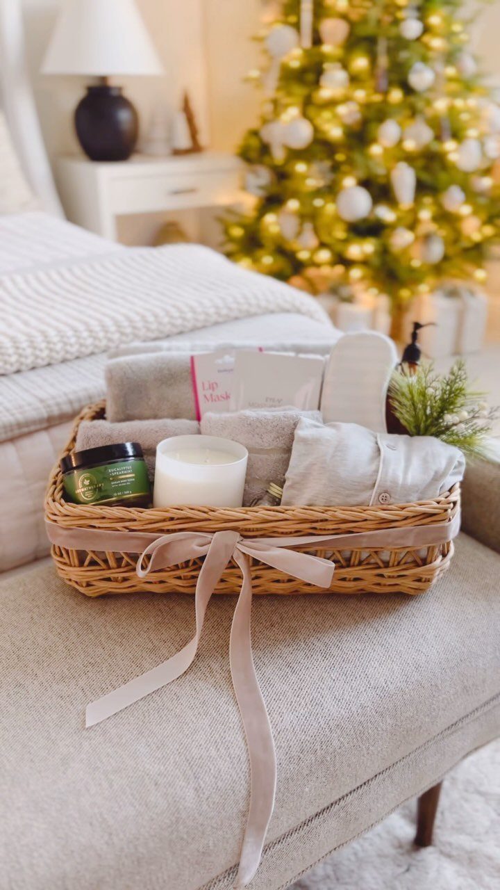 Spa Gift Basket Ideas: 8 Picks for Relaxing at Home 8 Wicker spa gift basket with towels, candle, and slippers near a Christmas tree
