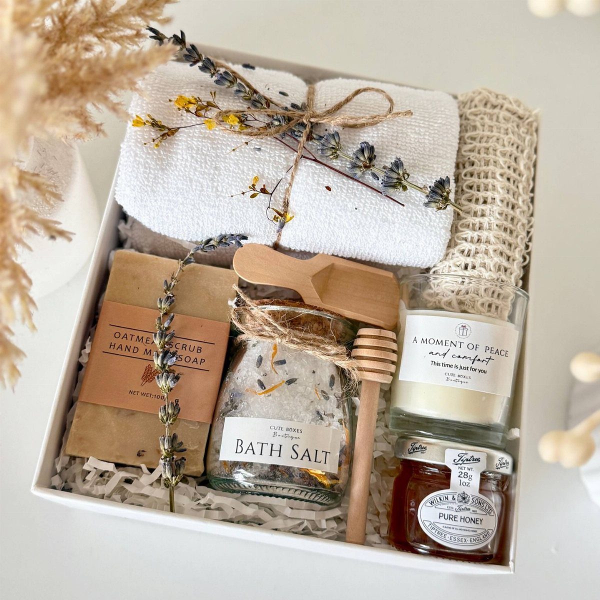 Spa Gift Basket Ideas: 8 Picks for Relaxing at Home 4 Lavender spa kit in a white box with bath salts, soap, and candle.
