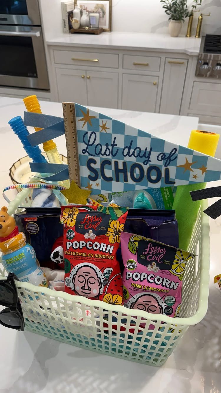 Light green gift basket filled with popcorn and a Last Day of School flag.