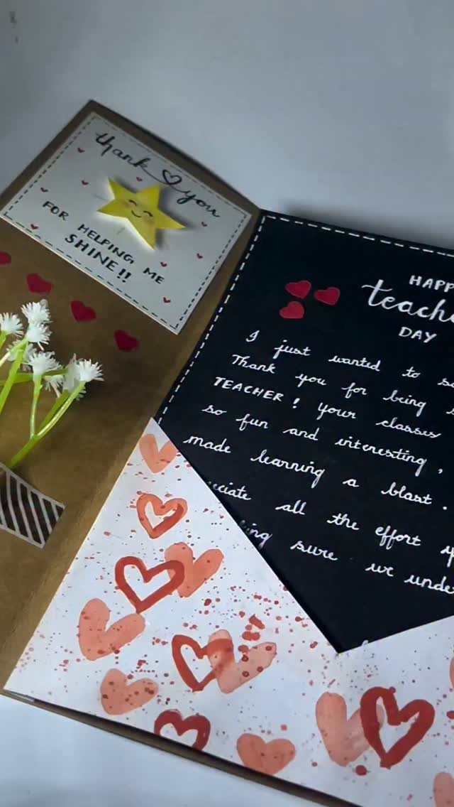 8 Teacher Gifts They Actually Want, From Notes to Totes 1 Handmade teacher's day card with handwritten note, red hearts, and small white flowers.
