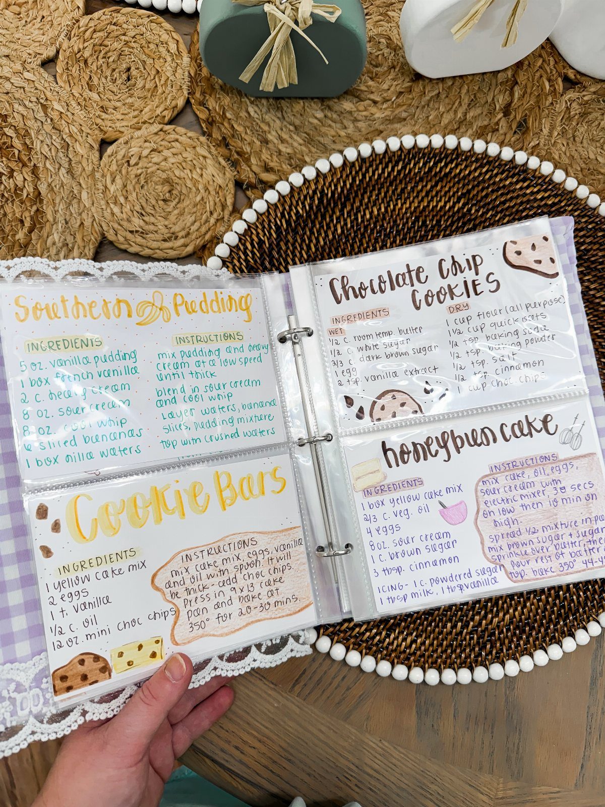 8 Teacher Gifts They Actually Want, From Notes to Totes 8 Open binder with handwritten recipe cards for pudding, cookies, and cake on a tray.