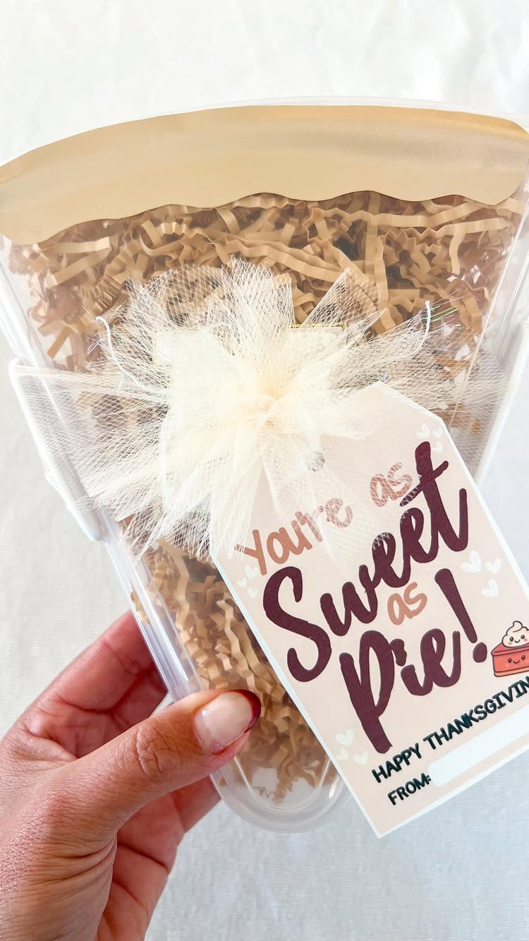 7 Thanksgiving Teacher Gifts for a Heartfelt Thank-You 1 Clear treat container with a Thanksgiving gift tag saying You're as Sweet as Pie