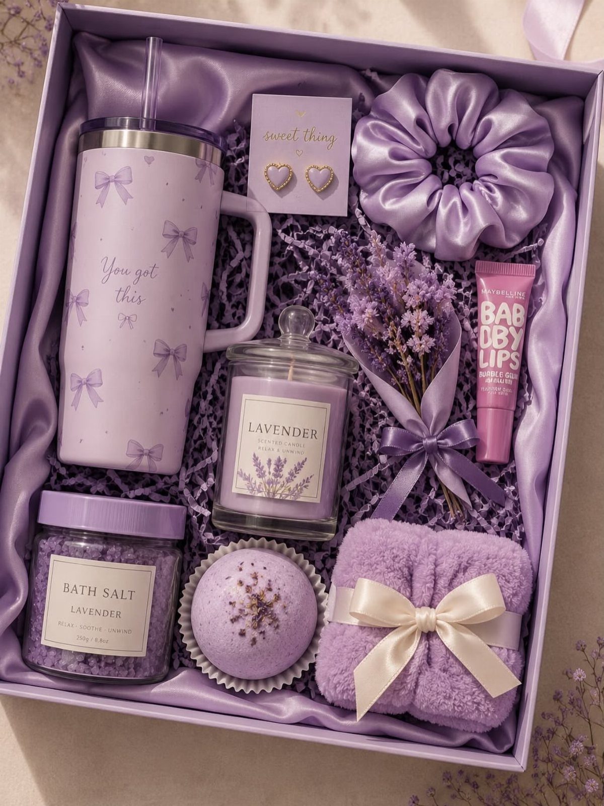 Lavender themed home spa kit in a purple box with bath products and accessories.