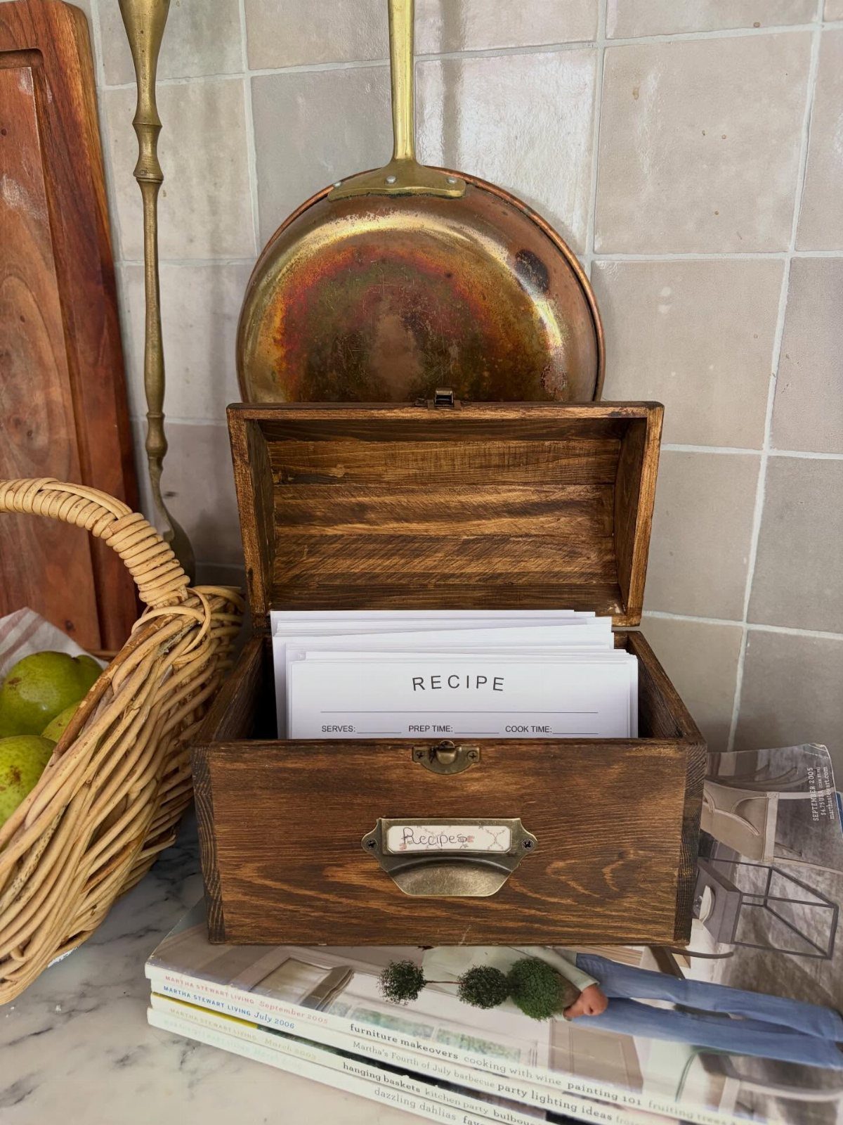 12 Useful Homemade Christmas Gifts People Will Use 7 Wooden recipe box filled with white cards on a kitchen counter with apples.